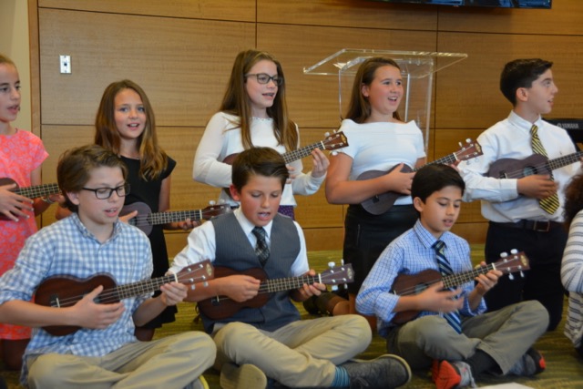 students pictured during their ukulele presentation